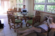 David reads his Stephen King novel while Bill works on his laptop.
