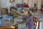 Kay enjoys some tofu, veggies, and rice stir-fry.
