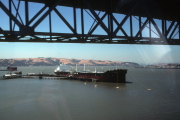 An oil tanker sits near the Benicia Bridge
