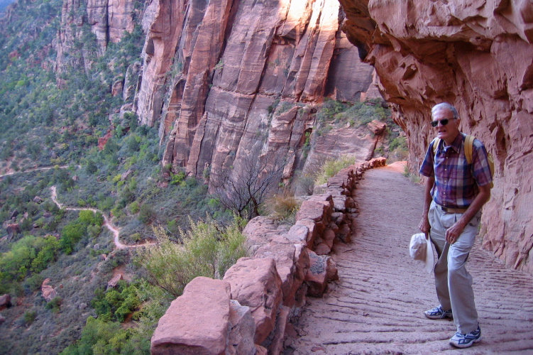 The trail is cut into the rock face.