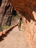 Hiking down under the overhanging rock.