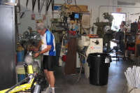 Ron polishes the end of some aluminum tubing.