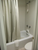 A small but servicable shower/toilet room.