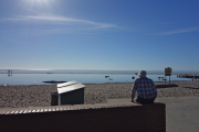 David enjoys the glare off the ocean while we wait for everyone to assemble.