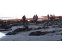 Ron, Kay, and Alice walk through the rocks.