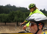 Laura and Bill on Valencia Rd. passing the apple orchards (230ft)