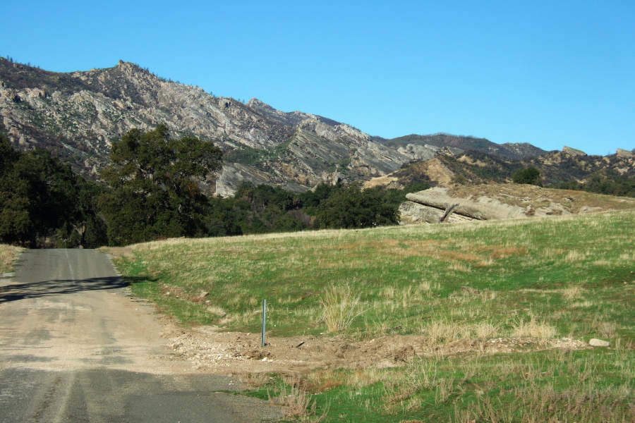 Land uplifted exposing the sandstone bedrock.