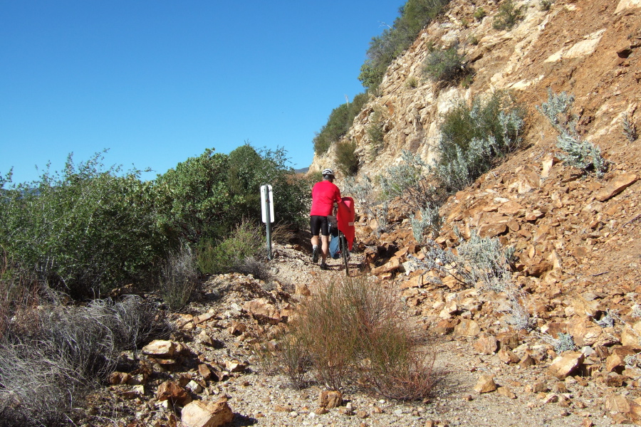 Ron walks past a rockslide.