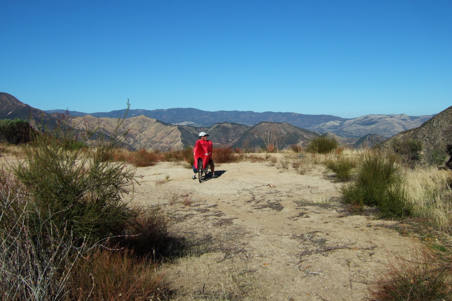 Ron stops to enjoy the commanding view where a gap in the ridge opens to the northeast. (2500ft)