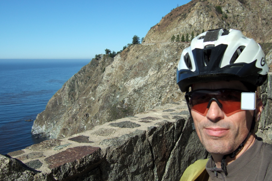 The road clings to the cliff near Partington Canyon.