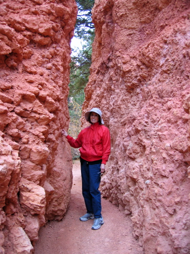 Kay passing through a gap in the rock.