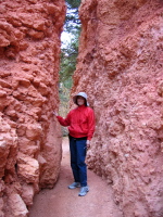Kay passing through a gap in the rock.