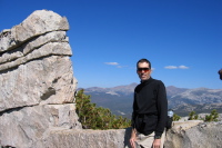 Bill on Cathedral Peak; Mt. Dana (13056ft) in the background. (10720ft)