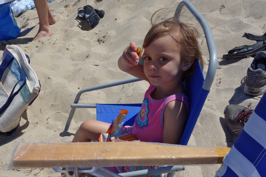 Natalie enjoys her energy bar.