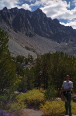 Bill stands below Cloudripper.