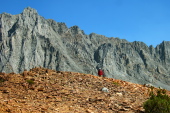Frank waits at the summit while Bill goes part-way down the northwest ridge of Chocolate Peak.