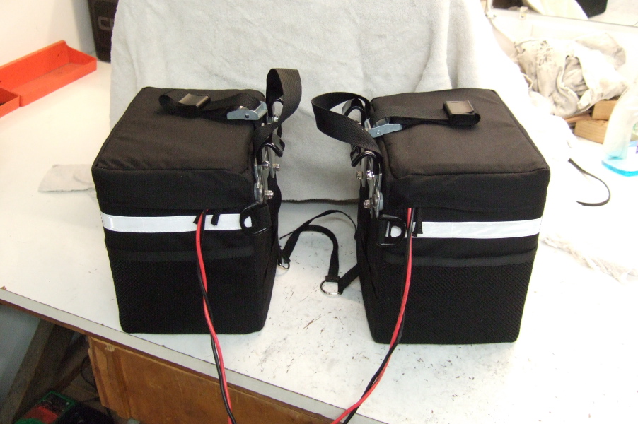 Panniers with batteries, ready to go on the bike.