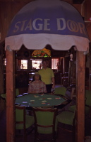 Chris stops to play cards at the Stage Door.