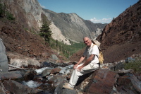 David rests on a rock at the site of the washed-out bridge over Convict Creek.