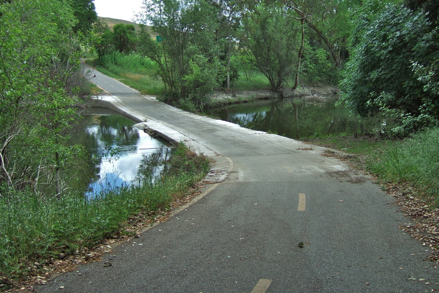 Coyote Creek Trail dips down to Coyote Creek.