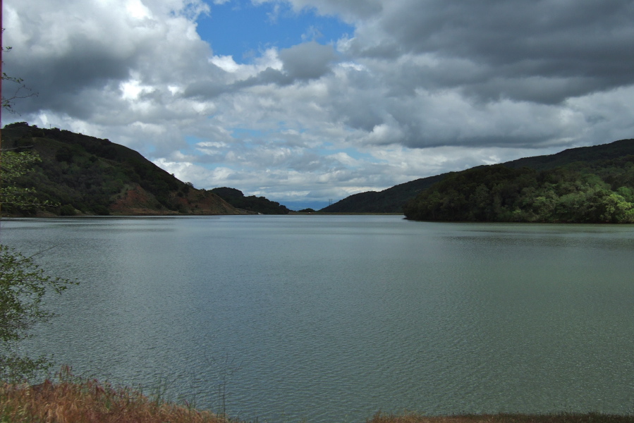 Clouds over a full Uvas Reservoir