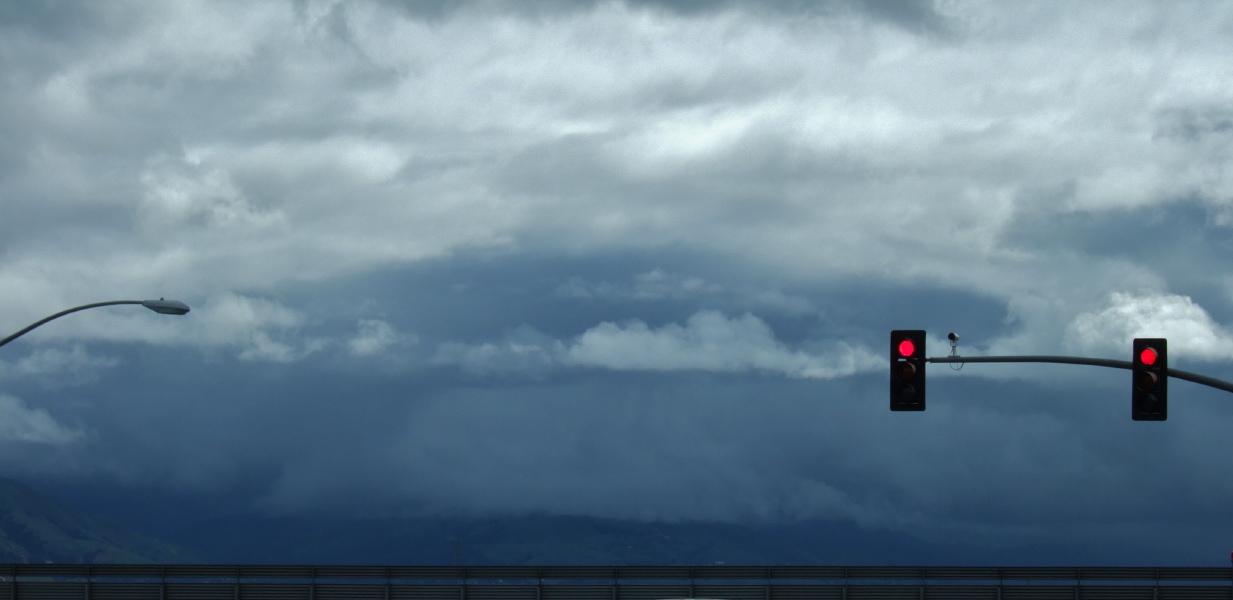 A dark cloud surrounds Mt. Hamilton.