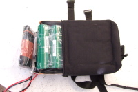 Battery halfway in bag.