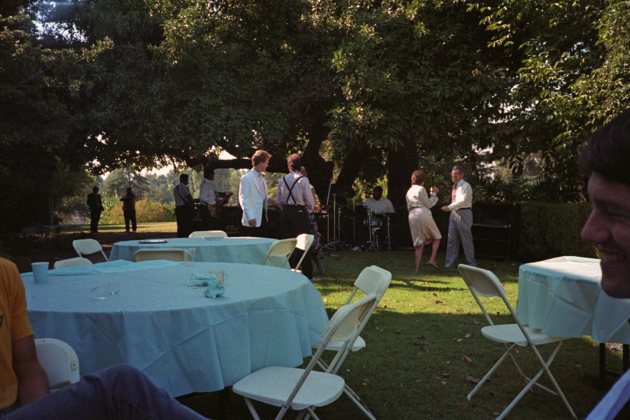 A few guests dancing.