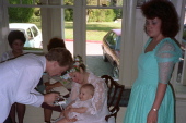Matthew gets a taste of wedding cake.