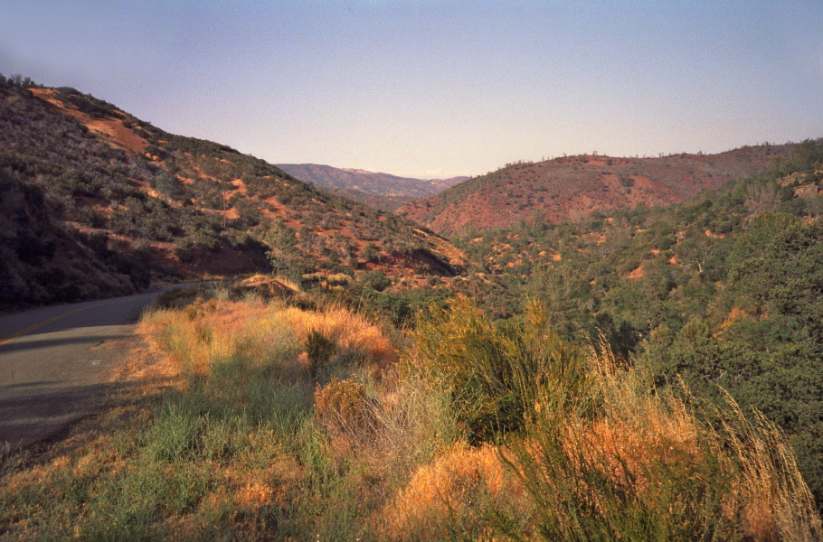 Chris (the blue speck at the center) climbs the steep section on Puerto Canyon Rd.
