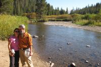Stella and Frank enjoy the idyllic edge of the San Joaquin River where it runs through Devil's Postpile National Monument.