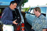 Bill shows Chris one of his ebike batteries.