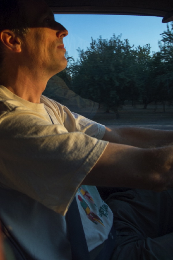 Bill at the controls, trying to keep the sun out of his eyes