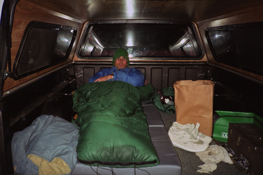 Bill tucked into the back of Dan's pickup.
