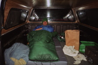 Bill tucked into the back of Dan's pickup.