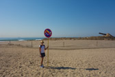 The sign is intended to mean "no bathing" or "no swimming".