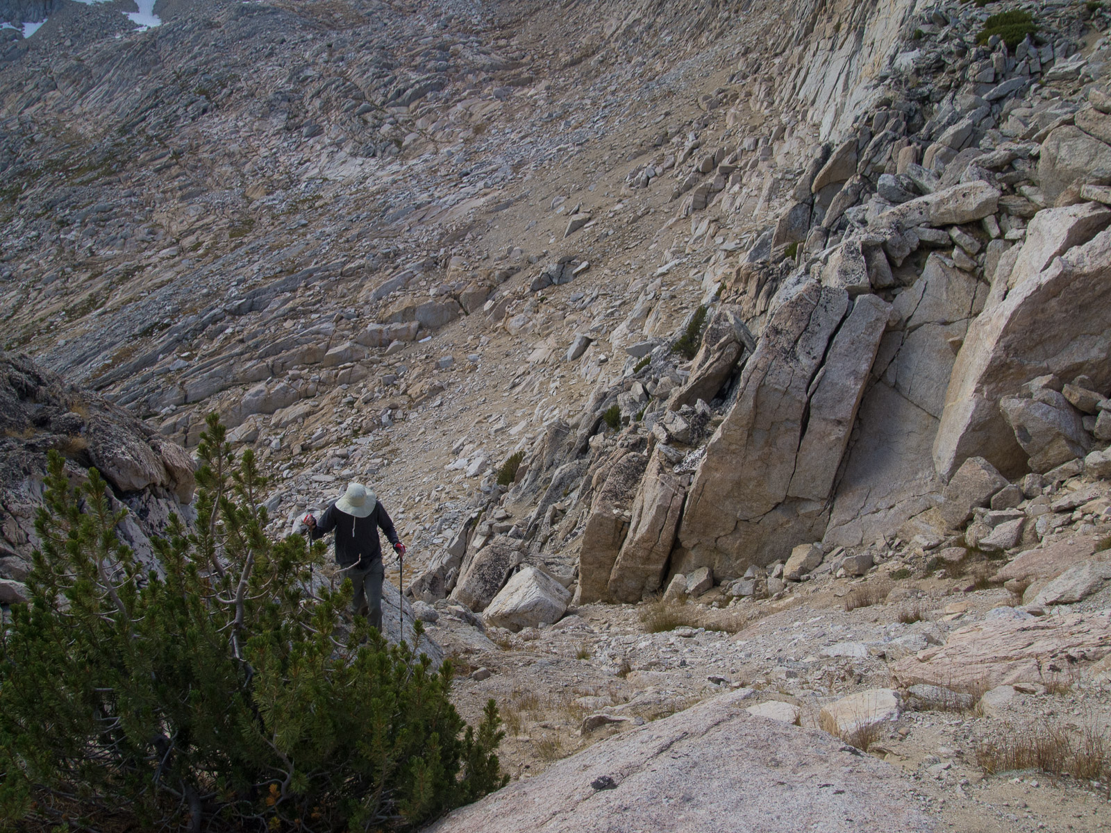 My conclusion:  Yes, one could probably climb/slide down this way to the south side of the East Ridge arete.  But, it looked difficuilt to climb up, should that be necessary.  And, I could not be sure the route didn't get cliffed out.  Photo courtesy of Frank Paysen.