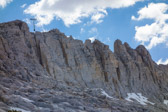 We got as far as the notch with the overhanging rock indicated by the arrow at the left.  Other spots along this ridge look more challenging than the spot at which we turned around.
