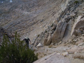 My conclusion:  Yes, one could probably climb/slide down this way to the south side of the East Ridge arete.  But, it looked difficuilt to climb up, should that be necessary.  And, I could not be sure the route didn't get cliffed out.  Photo courtesy of Frank Paysen.