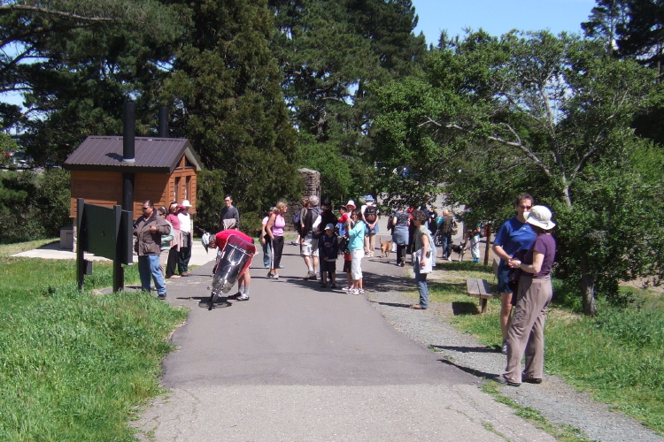Ron collects a small audience while he adjusts his bike.
