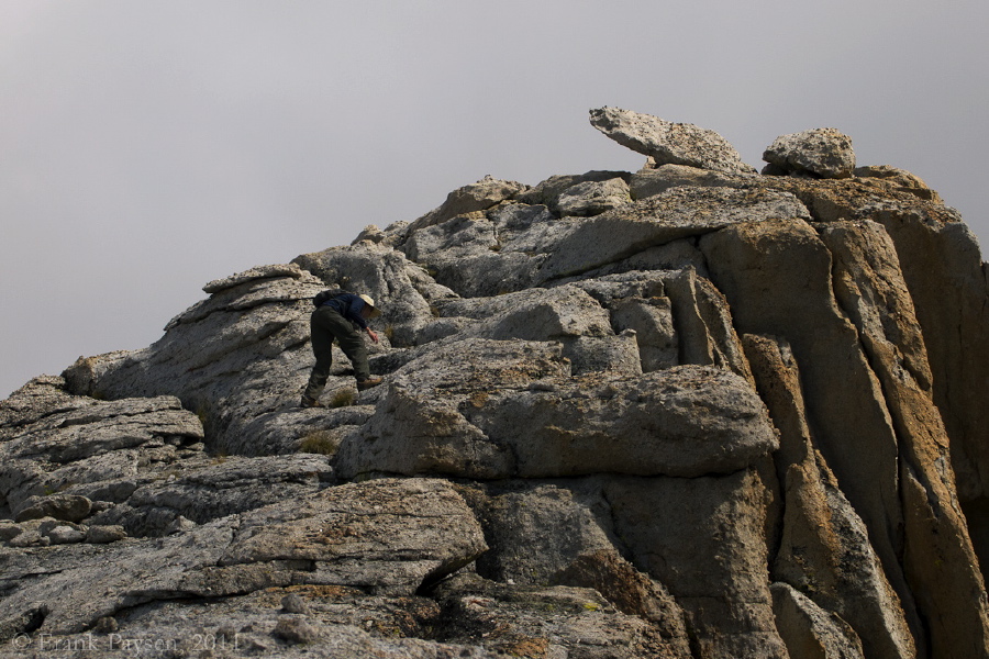 Bill climbs up the final blocks to the summit area.