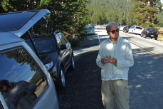 David eats a sandwich for breakfast before the hike.