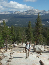 David hikes up the slabs on the use trail to Budd Lake.