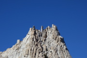Climbers peer down at us from the summit.