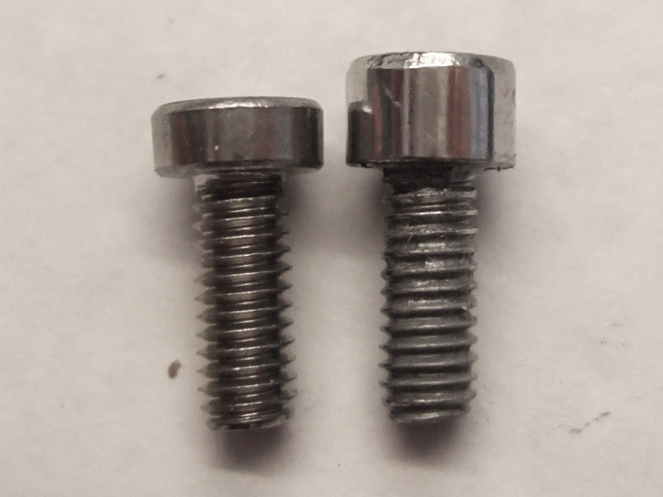 I replaced the stock high-profile bolts on the drive side of the Edge1500 motor with the low-profile bolts so that my rear derailleur cage could shift into the large sprocket without striking the bolt heads.  The low-profile heads take a 2.5mm Allen key, but the high-profile heads take a 4mm.