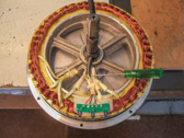 The tip of the screwdriver points to the stub end of the white wire.