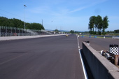 Bill heads down the main straight at PIR in front of his many fans.