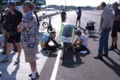 Josh Kerson prepares his bike while Bill looks on.