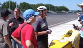 Bill talks with a couple of the course marshalls while taking notes.