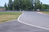 Bill rounds the sharp right-hand curve.